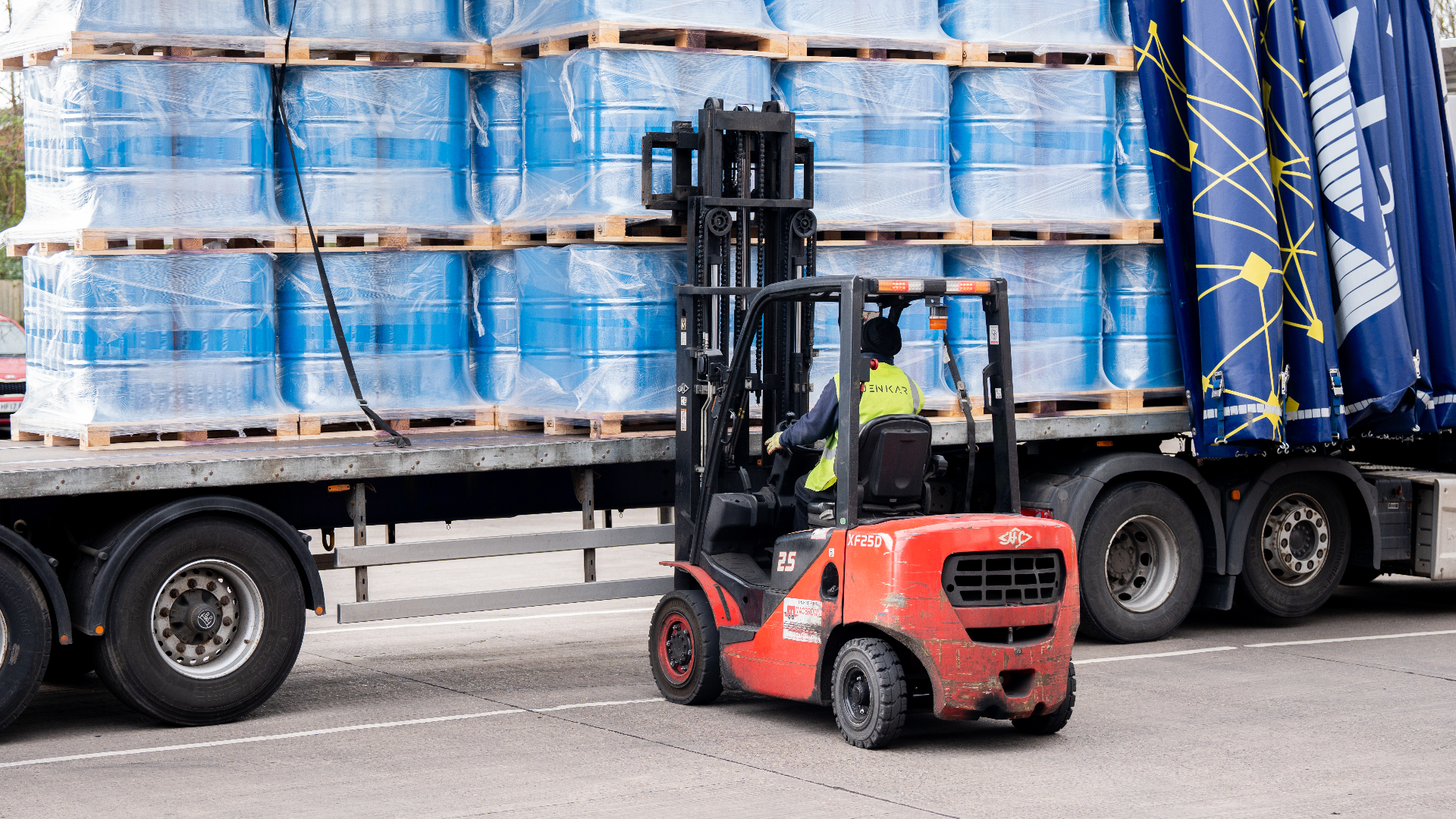 Forklift loading freight onto a Jenkar Shipping trailer