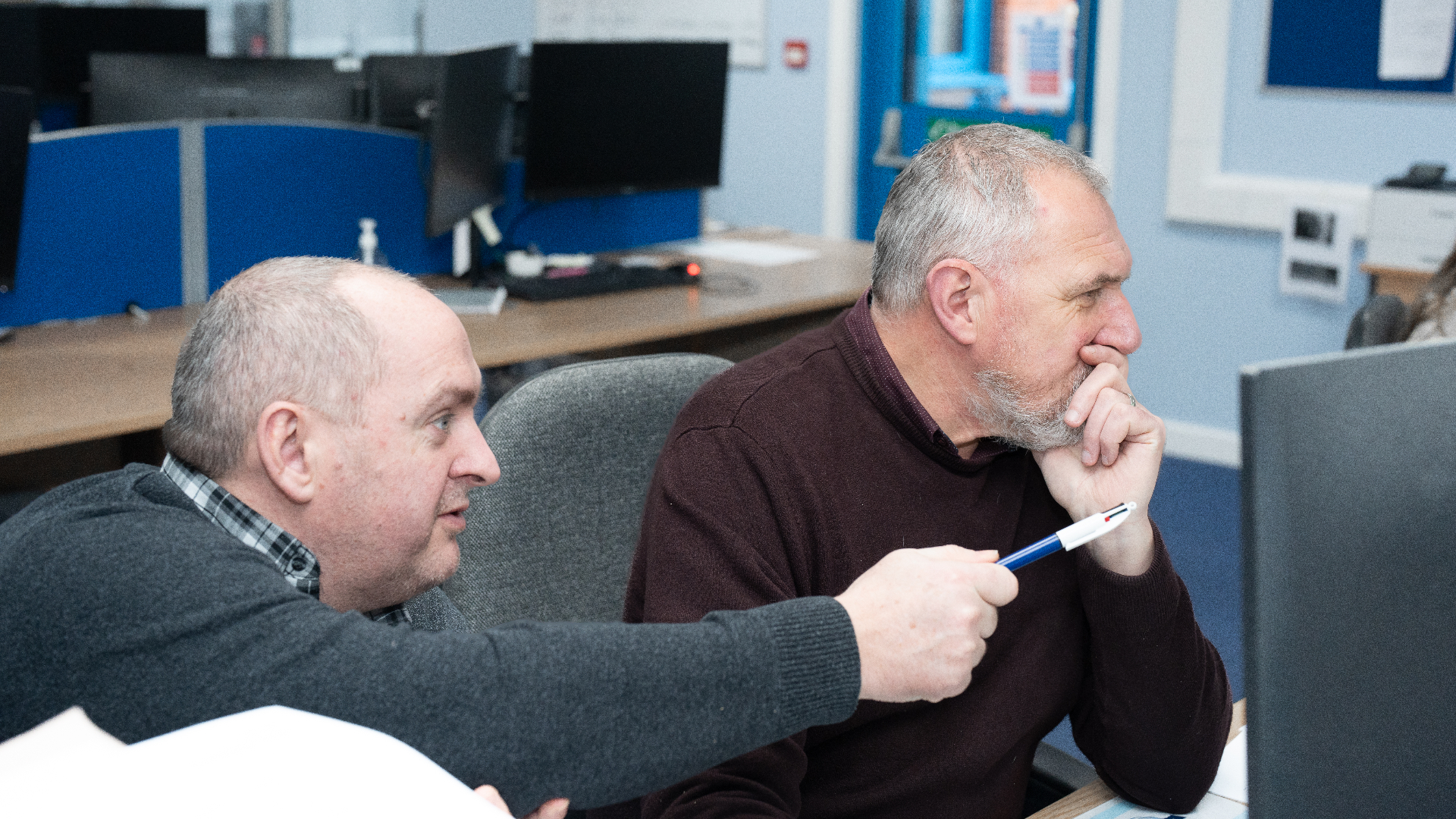 Jenkar team members reviewing workflows together