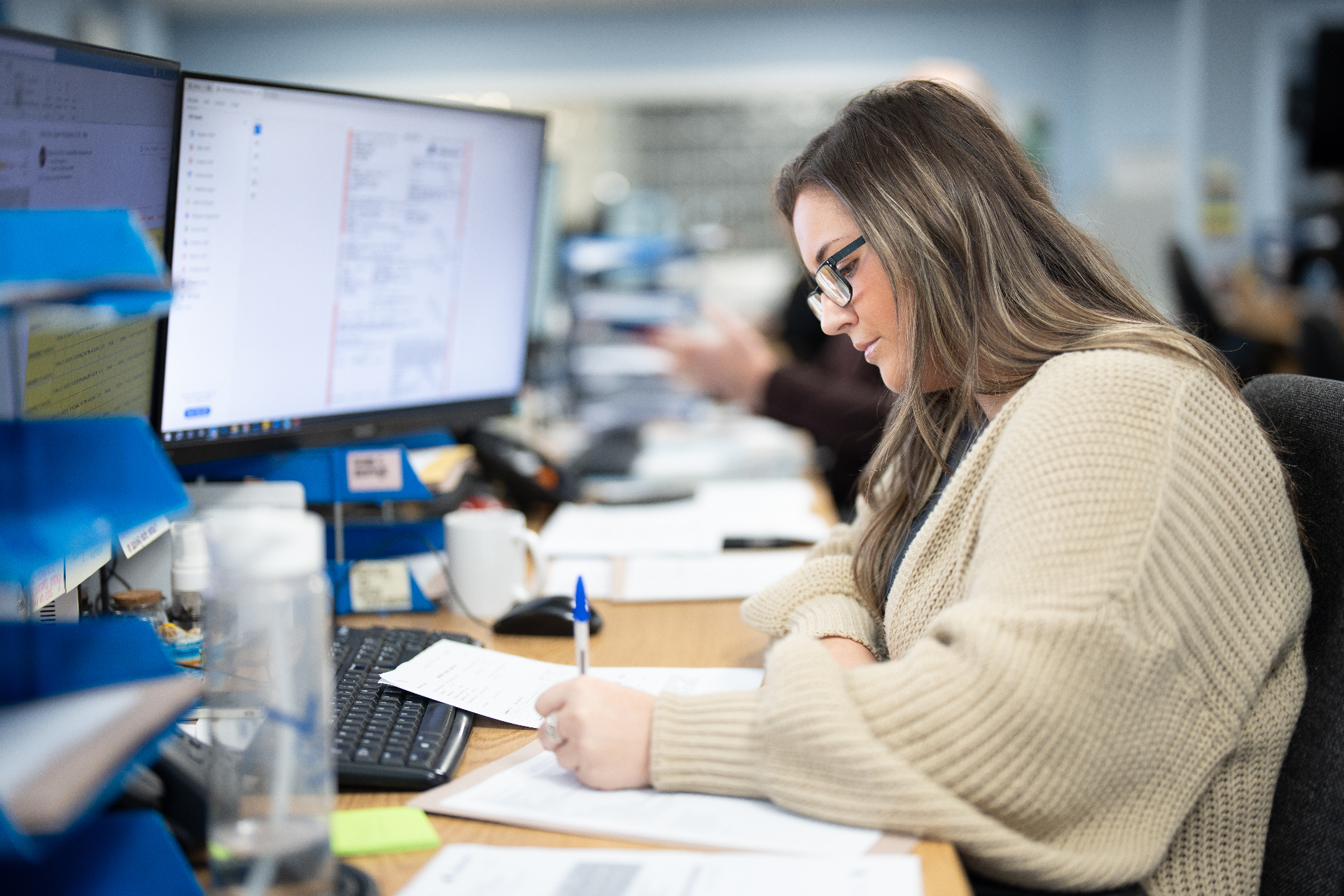 Jenkar ops team working through paperwork at the desk